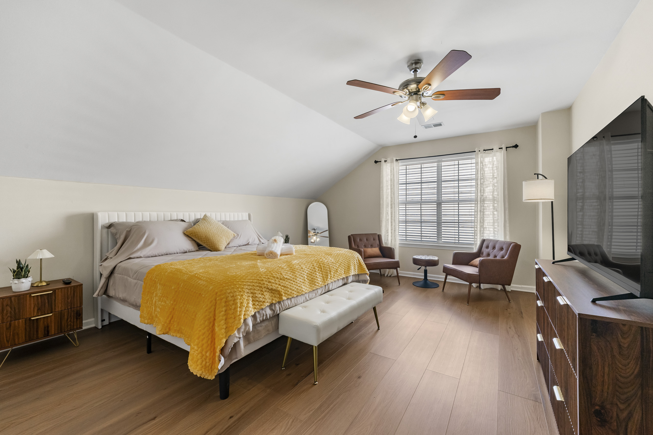 Large private bedroom with lounge seating prepared for a longer stay