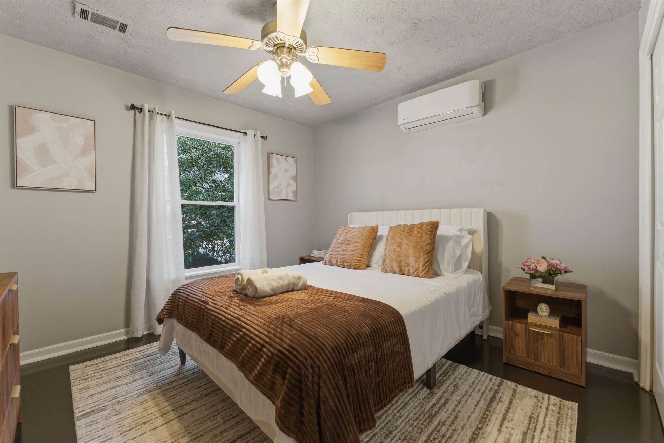 Standard private bedroom with neutral furnishings for a longer assignment